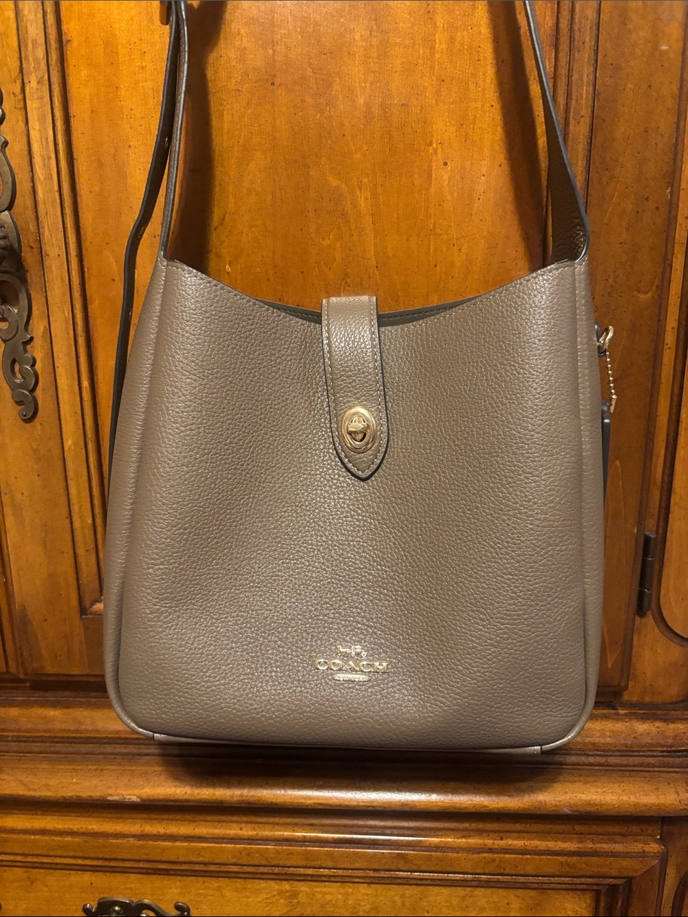 Coach Hadley Convertible Crossbody Bag in a dark stone pebble leather finish